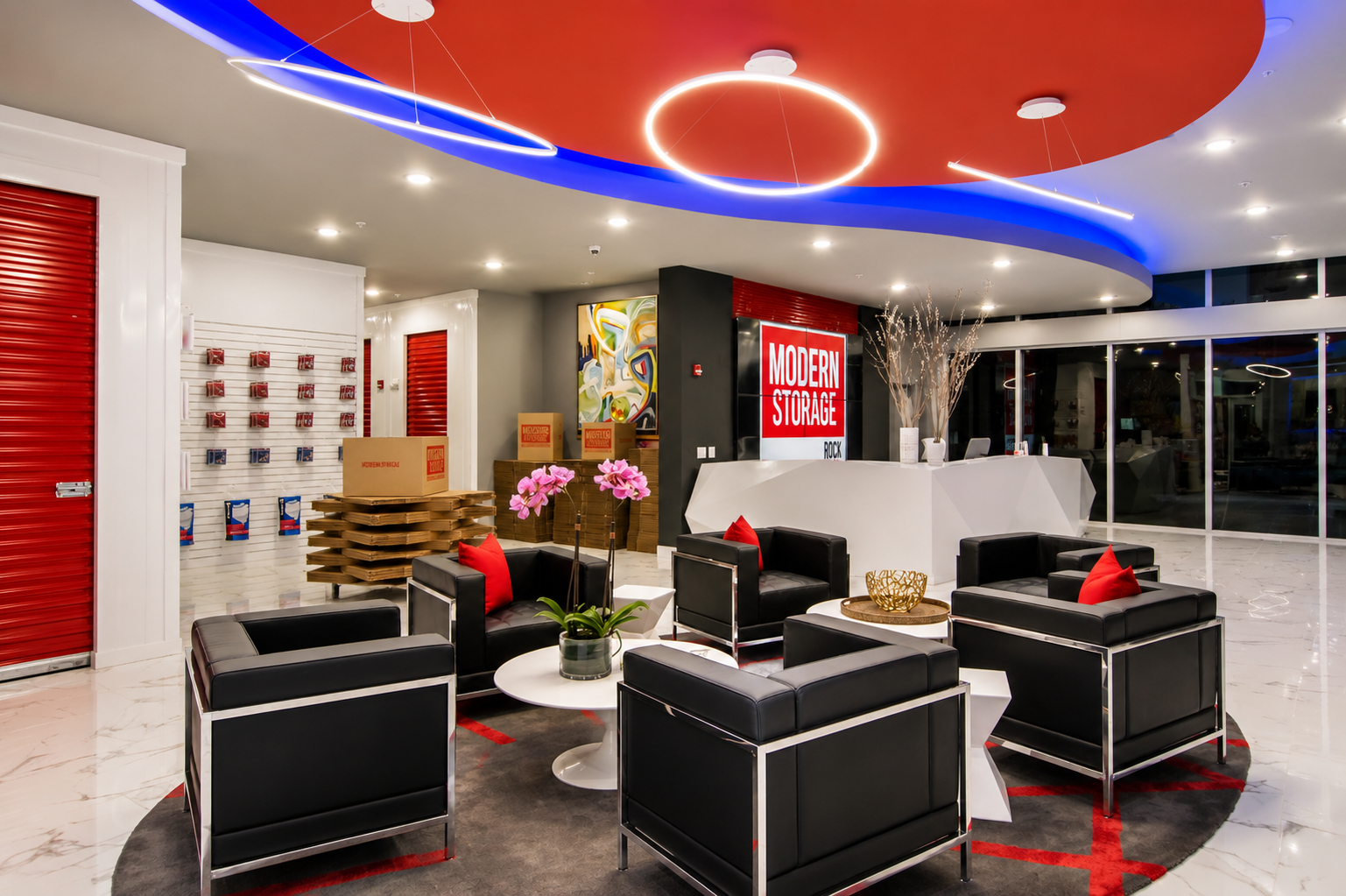 Modern Storage® West Little Rock office interior with red accent wall, modern seating, bright lighting, and polished floors